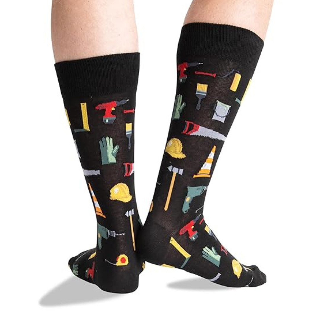 Model wearing black socks with construction tool print