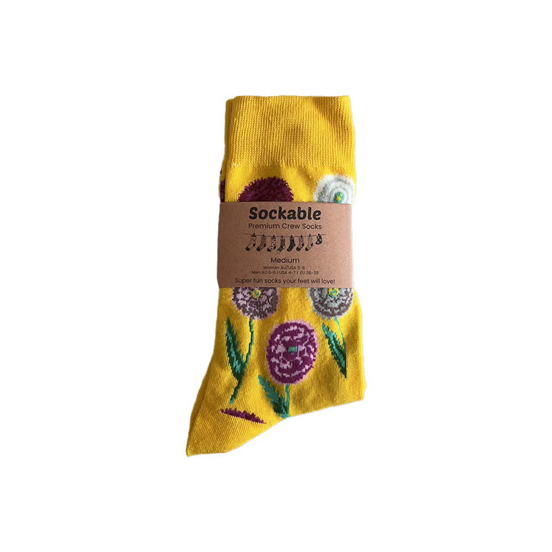 Yellow sock with floral design and 'Sockable' label on a white background