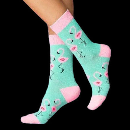 Turquoise socks with pink trim and flamingo print worn by model