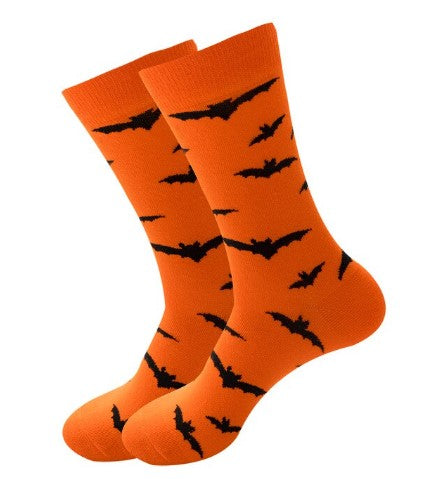 A pair of orange socks with black bat patterns, designed for adults, perfect for Halloween.