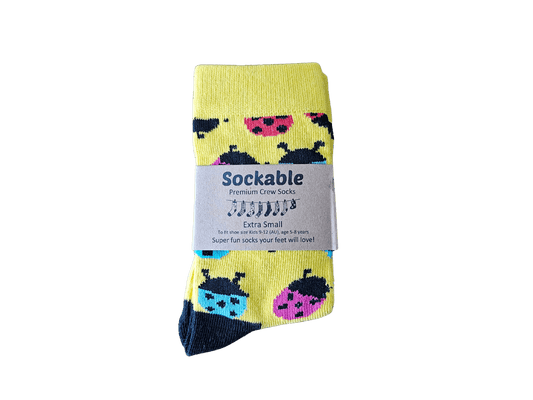 Pack of socks with ladybug design on a black background