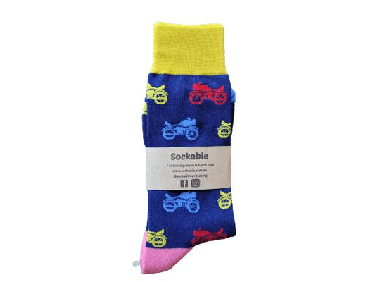 Multicoloured motorcycle socks labelled with recycled card ready for fundraising or gifting