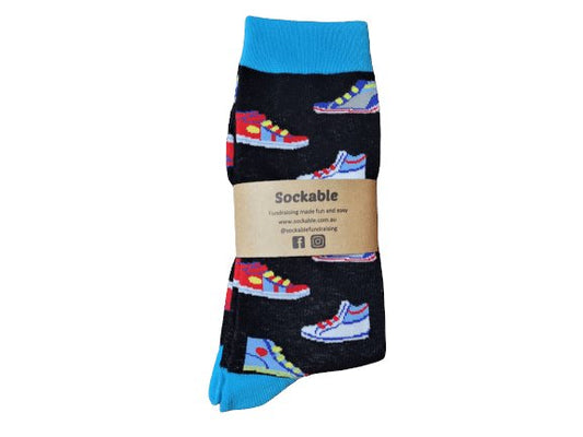 Black socks with sneakers on them and a blue cuff, heel and toe