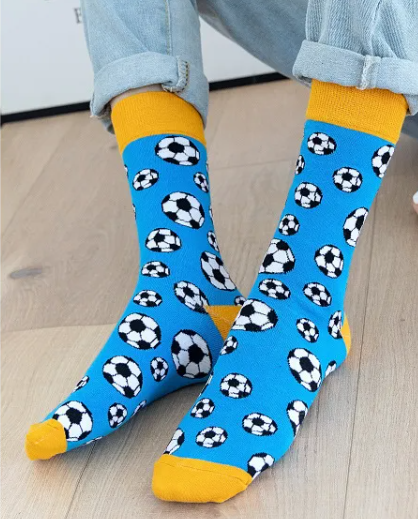 Blue and yellow soccer ball socks worn by model