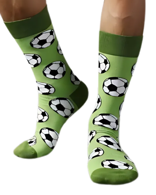 Green socks with soccer ball pattern worn by a person on a white background