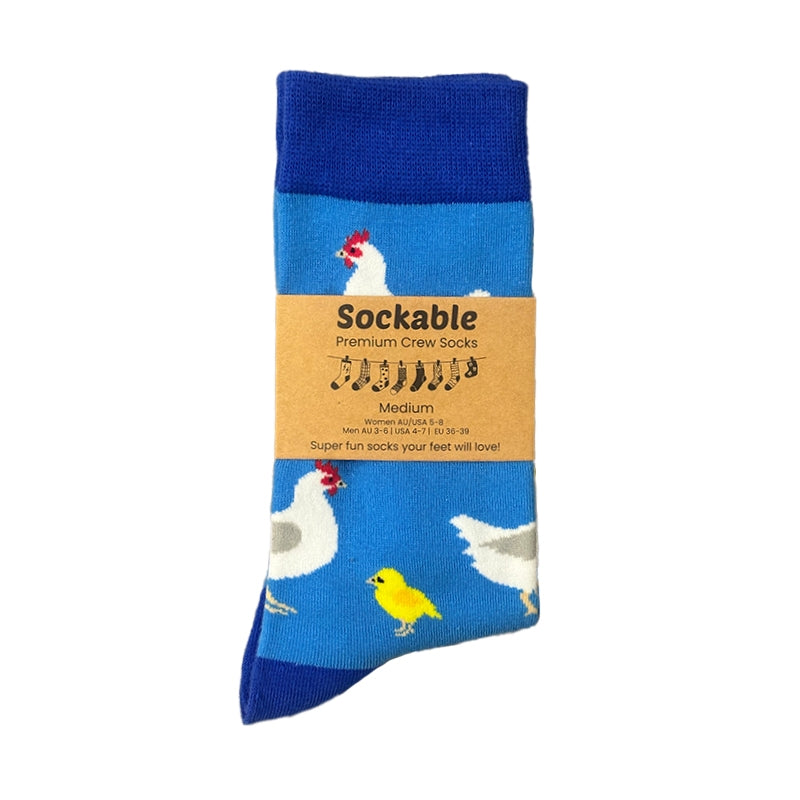 Blue sock with chicken and rooster design on a white background