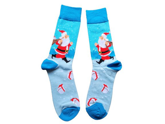 A pair of blue socks with a Christmas-themed design featuring Santa Claus and reindeer on a snowy background.