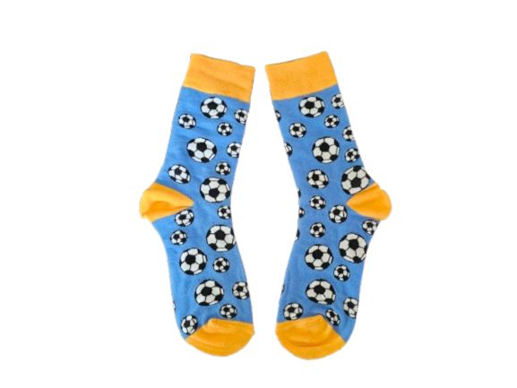 A pair of blue crew socks with a black and white soccer ball pattern, featuring yellow toes, heels, and cuffs, displayed against a plain white background.