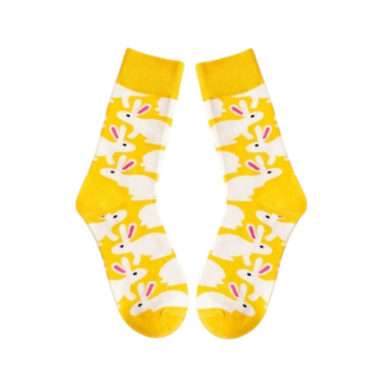 A pair of yellow socks with a pattern of bunny rabbits.