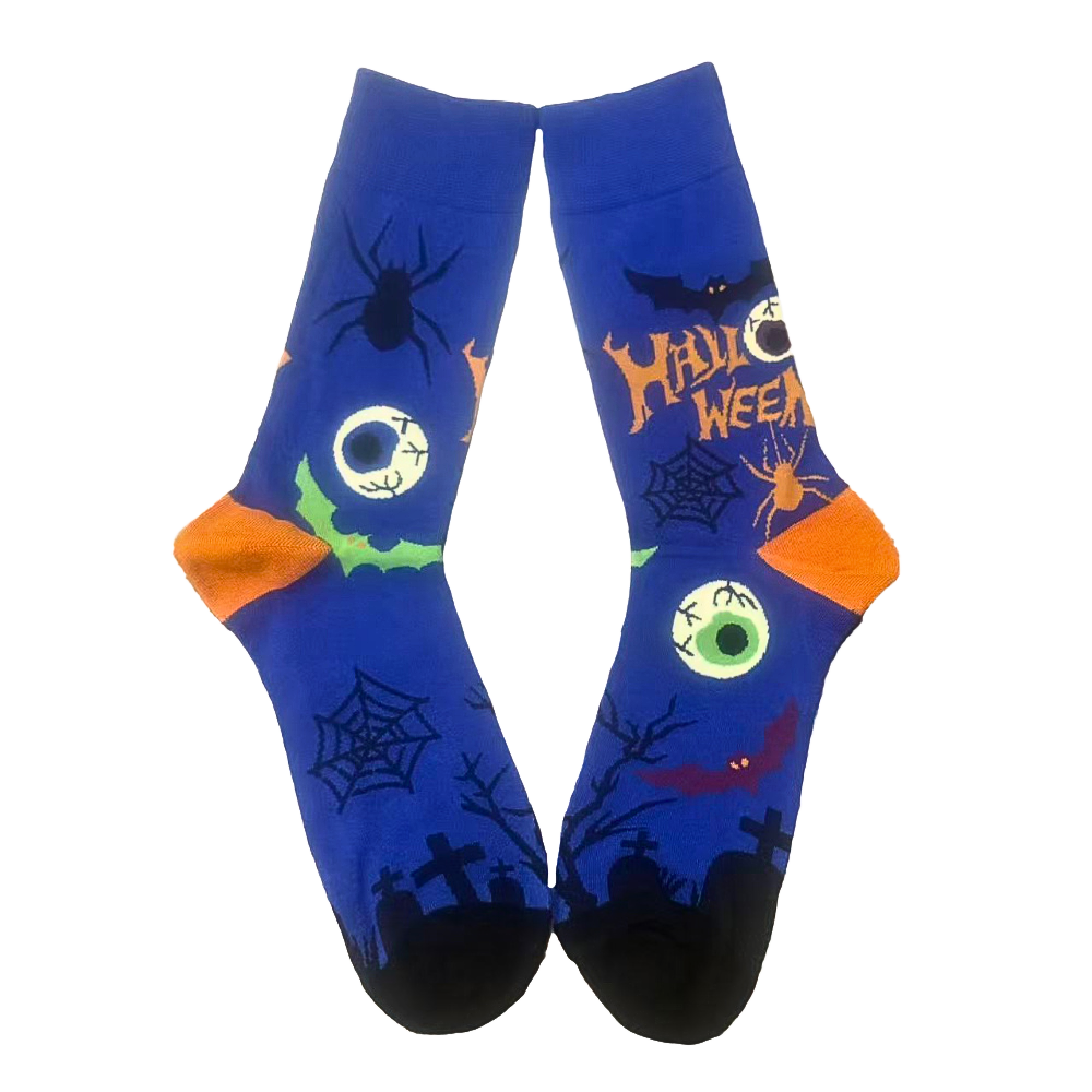 Halloween-themed socks with spider, witch, and pumpkin design on a white background