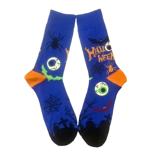 Halloween-themed socks with spider, witch, and pumpkin design on a white background