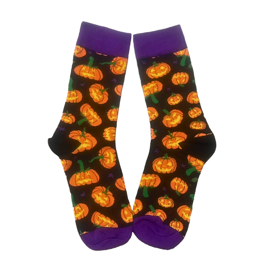 Halloween-themed socks with pumpkins on a black background