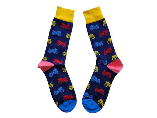 dark blue socks with a colourful motorcycle print laid flat on a white background