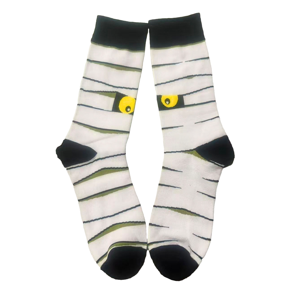 Mummy-themed socks with black eyes on a white background