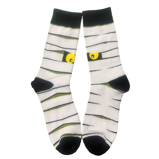 Mummy-themed socks with black eyes on a white background