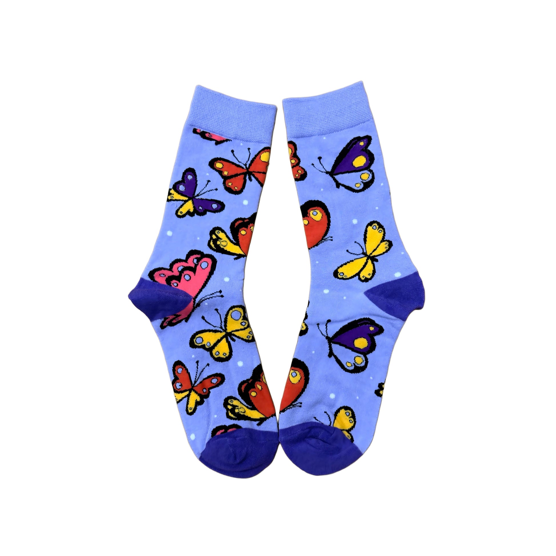 Colorful butterfly-patterned socks on a purple background