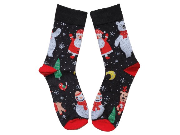 A pair of Christmas-themed Santa After Dark socks with a pattern featuring Santa Claus, a reindeer, and holiday decorations on a black background with red tips.