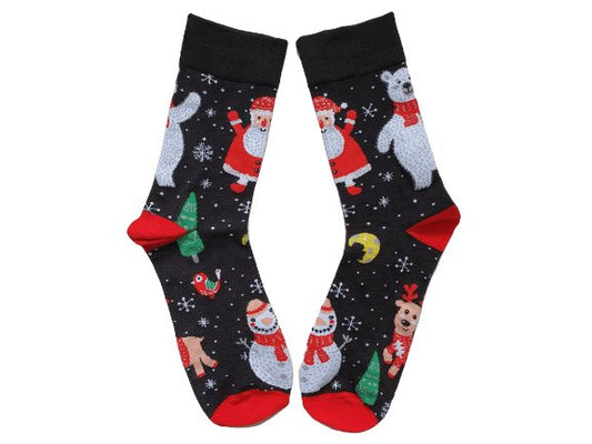A pair of Christmas-themed Santa After Dark socks with a pattern featuring Santa Claus, a reindeer, and holiday decorations on a black background with red tips.