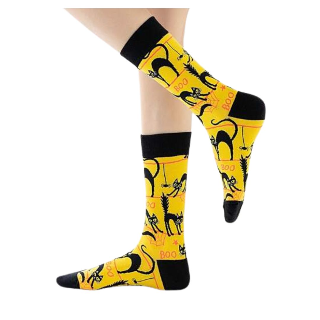 Yellow socks with black cat designs and 'Boo' text on a white background