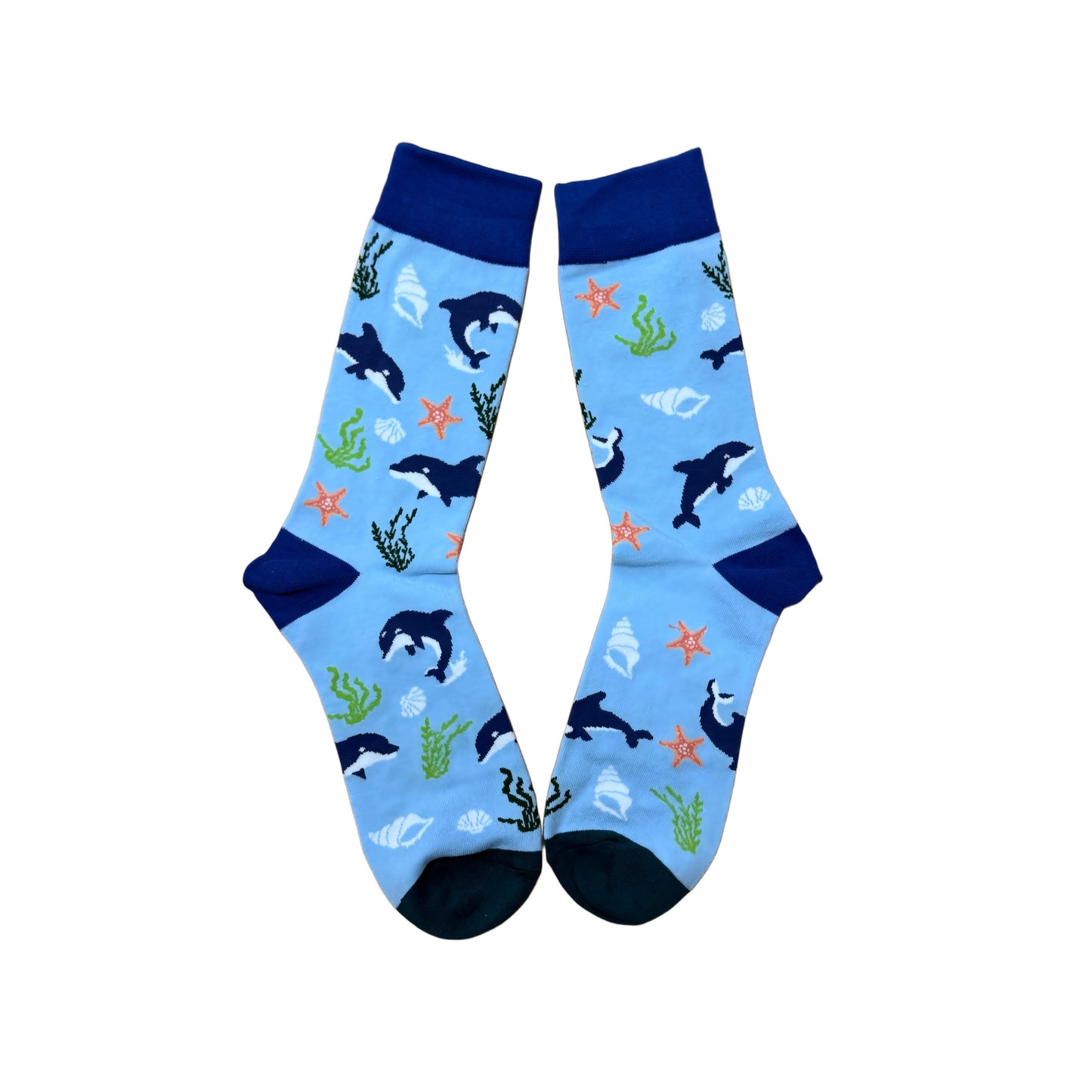 Pair of socks with whale and sea plant pattern on a light blue background