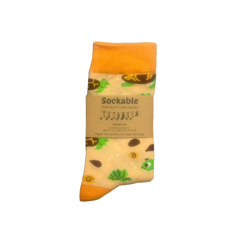Packaged sock with a turtle design on a white background