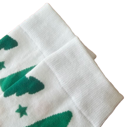 White socks with green tree patterns on a white background