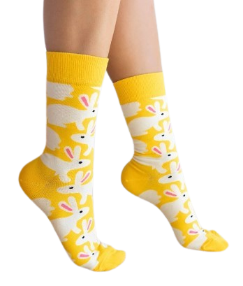 Model wears yellow socks with a white bunny print