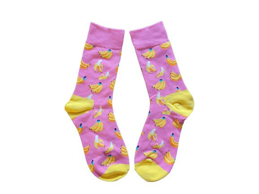 Pink socks with banana pattern on a white background