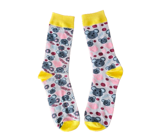 Pair of socks with koala and floral pattern on a pale pink background