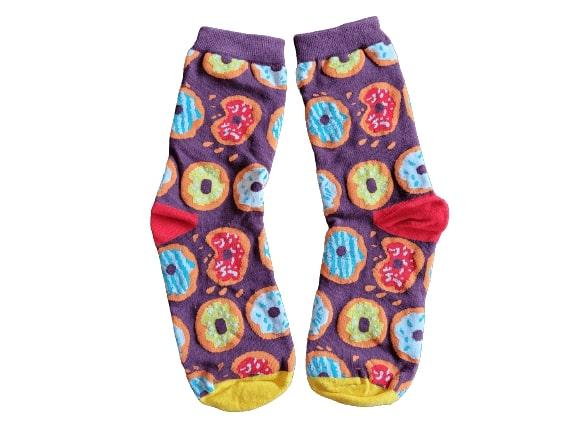 Colorful donut-patterned socks on a white background