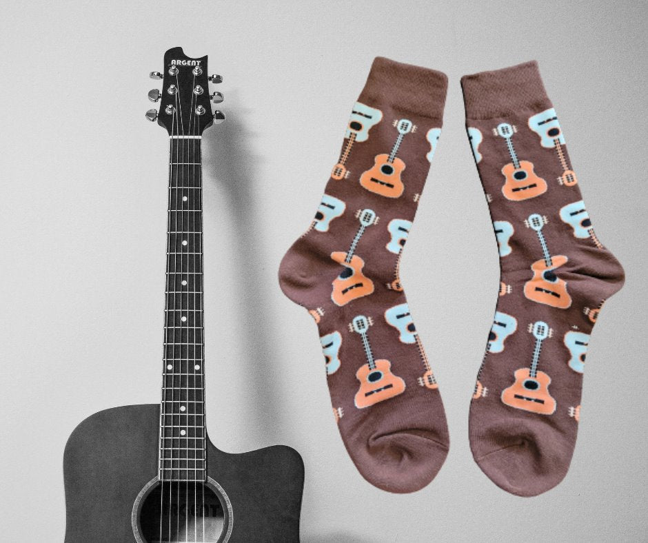 Brown crew socks featuring pictures of acoustic guitars